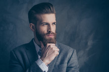 Portrait Of Handsome Stylish Young Man With Mustache, Beard And Beautiful Hairstyle Keep Calm And Think While Hold Beard And Chin With Hands