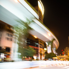 Wall Mural - Abstract traffic lights in motion blur at night.