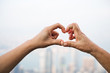 © xy - The form of heart shaped by two hands.