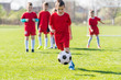 © Dusan Kostic - Kids soccer football - children players exercising before match on soccer field