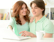 © aletia2011 - Beautiful young couple with a laptop