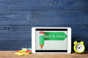 Wall Mural - Tablet with BACK TO SCHOOL message and stationery on wooden table