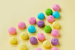 photo of tasty colorful marshmallows on the wonderful yellow background