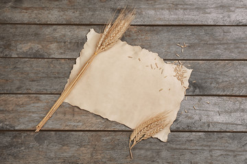 Sheet of paper with space for text on wooden background