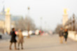 People walking on the Alexandre III Bridge in Paris, which is one of the most famous and beautful bridge in the city..The photo is purposely shot  out of focus