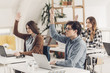 © LStockStudio - College Students Raising Hands