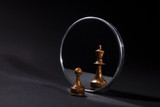 Fototapeta  - Pawn looking in the mirror and seeing a king.