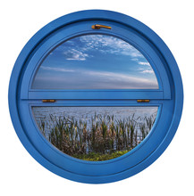 View From A Round Blue Window On A Countryside Landscape, Shore Of A Lake And Blue Sky With Clouds.