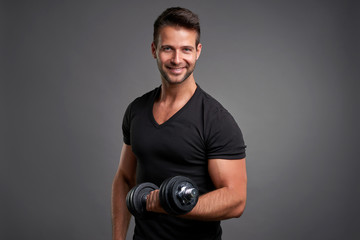 Young man lifting weight