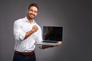 Wall Mural - Young man with laptop