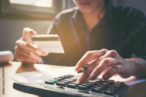 Saving Money Concept Man Hand Using Calculator And Holding Credit Saving Money Concept Man Hand Using Calculator And Holding Credit Card Ping Online Row Coin