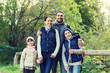 © Syda Productions - happy family with backpacks hiking