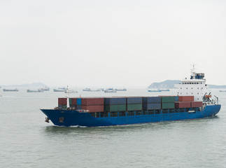 container ship arriving in port.