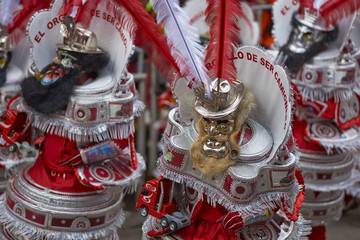 Wall Mural - Masked Morenada dancers in ornate costumes parading through the mining city of Oruro on the Altiplano of Bolivia during the annual carnival.