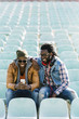 © santypan - Two black race friends having fun.