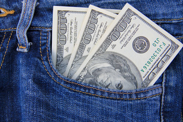 American dollar banknotes in jeans pocket