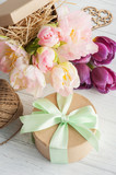 Fototapeta Desenie - Fresh pink tulip flowers in gift kraft box