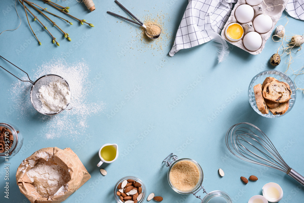 Baking or cooking background frame. Ingredients, kitchen items for baking cakes. Kitchen utensils, flour, eggs, almond, cinnamon, oil. Text space, top view. - obrazy, fototapety, plakaty 