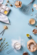 © juliet_boo - Bakery background frame. Fresh cooking ingredients - egg, flour, sugar, butter, nuts over blue background. Spring cooking theme. Top view, copy space.