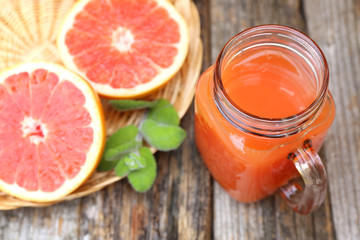 Wall Mural - Grapefruit juice in glass jar