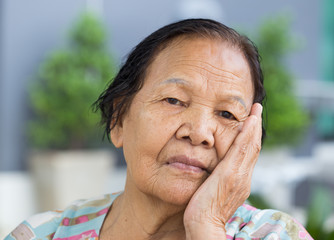 Wall Mural - senior woman with worried stressed face