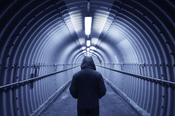 Poster - Silhouette of men standing at end of tunnel