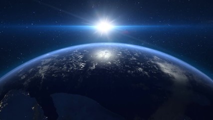 Wall Mural - sun rising over earth