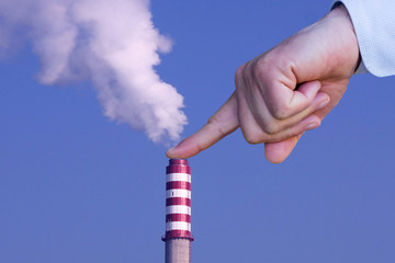 Man with hand making stop to environmental pollution