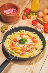 Wall Mural - Tasty spaghetti with tomato sauce and meat in pan on wooden table.