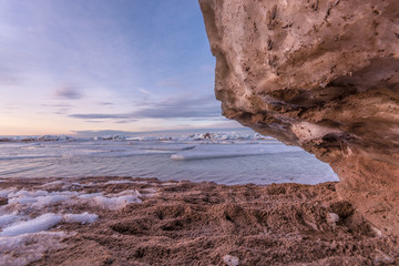 Wall Mural - Winter landscape. Coast line. Sea covered blocks of ice.