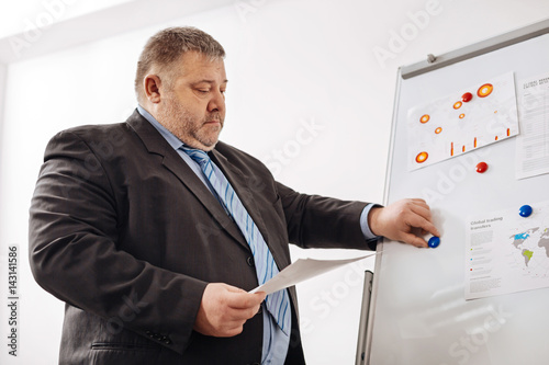 Fotografie, Obraz Focused tired employee making a presentation