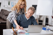 © zinkevych - Initiative office manager working with colleague in the office