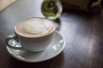 Wall Mural - cup of coffee and  on wood blackground