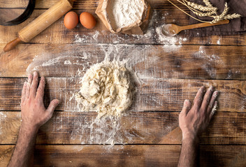 Canvas Print - Man prepares the dough for making bread