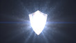 The concept of protection. Bright shield icon with rays