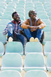 © santypan - Two black race friends having fun in the park.