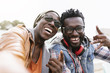 © santypan - Two black race friends having fun.