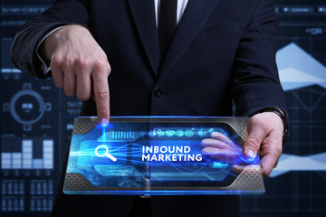 Business, Technology, Internet and network concept. Young businessman working on a virtual screen of the future and sees the inscription: Inbound marketing