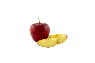 Red apple next to a sliced apple on a white background. Isolated apple on a white background.