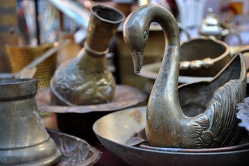 Antique objects displayed on flea market.