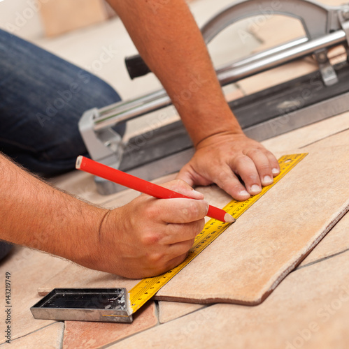 Laying Ceramic Floor Tiles Man Hands Marking Tile To Be
