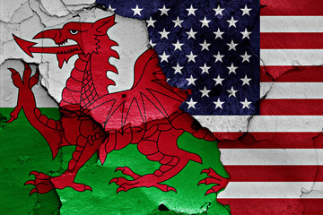 Wall Mural - flags of Wales and USA painted on cracked wall