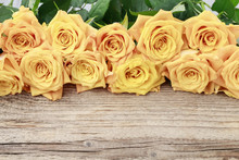 Orange Roses On Wooden Table