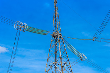 High-voltage power lines against the sky