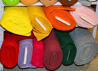 fabric for sale on the shelves of haberdashery