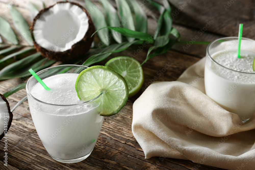 Composition with fresh coconut milk on wooden table