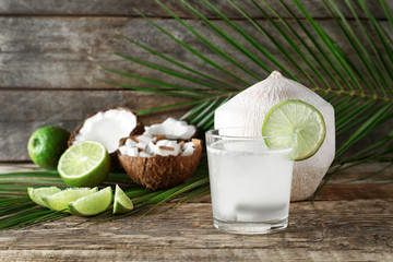 Wall Mural - Composition with fresh coconut milk on wooden table