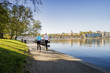 © FOLIO - Sweden, Stockholm, Skeppsholmen, People running near harbor