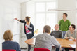 © FOLIO - Sweden, Young woman drawing on white board during work meeting