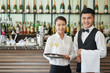 © DragonImages - Restaurant waiters